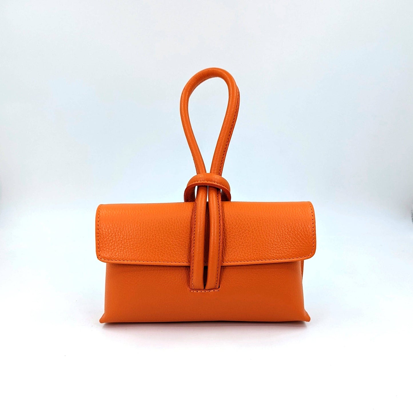 Chic leather clutch bag with pull through loop strap