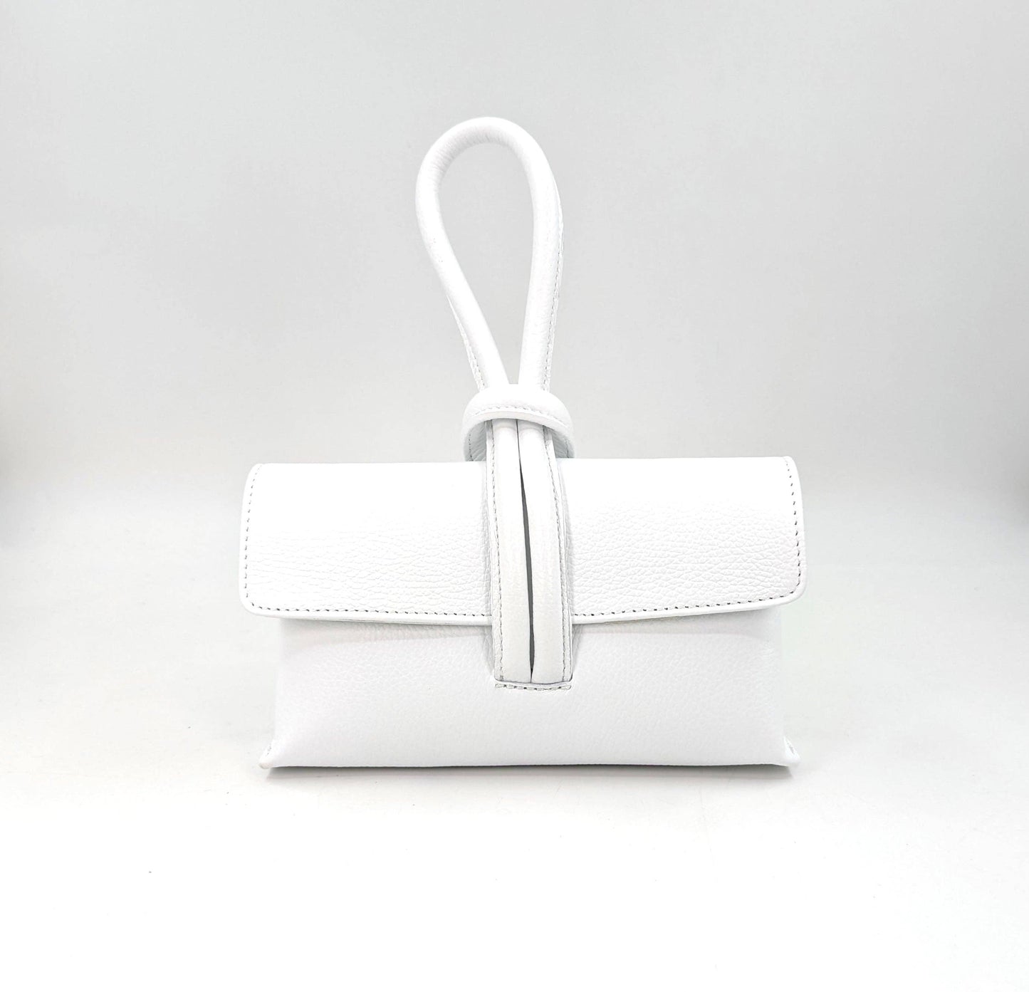 Chic leather clutch bag with pull through loop strap