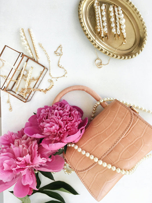 Handbag with peonies and pearl jewellery